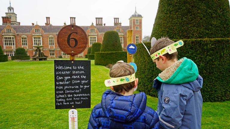 Children looking at a weather station on an Easter trail at Blickling Estate